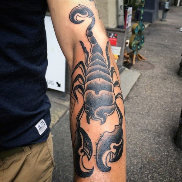 Grey And Black Scorpion Tattoo On Man Left Arm