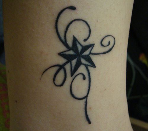 Grey And Black Small Nautical Star Tattoo On Bicep