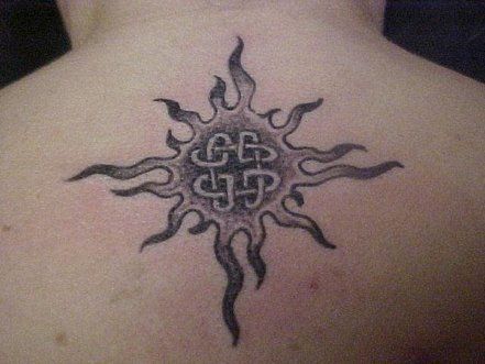 Grey Ink Celtic Sun Tattoo On Upper Back