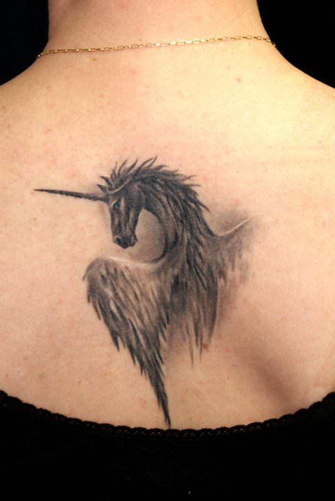 Grey Ink Gothic Unicorn Tattoo On Upper Back
