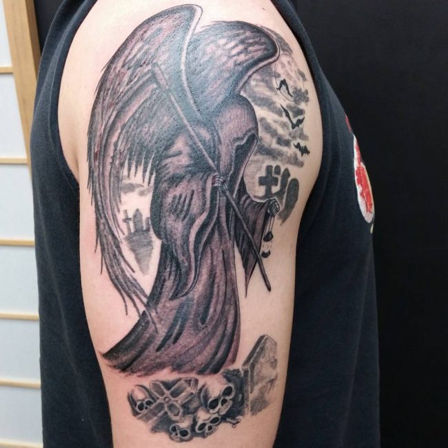 Grey Ink Winged Grim Reaper Tattoo On Man Right Shoulder