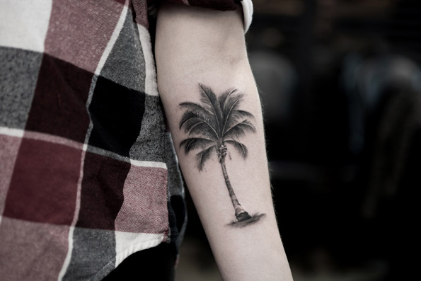 Grey Palm Tree Tattoo On Left Forearm