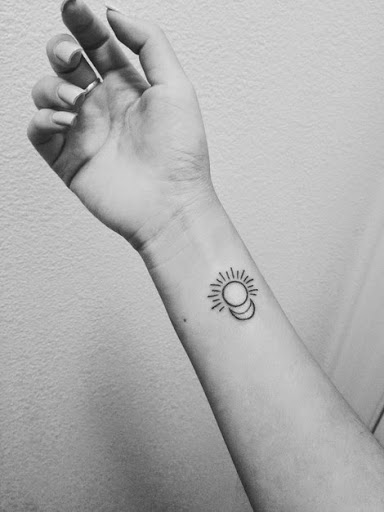 Half Moon And Small Sun Tattoo On Right Forearm