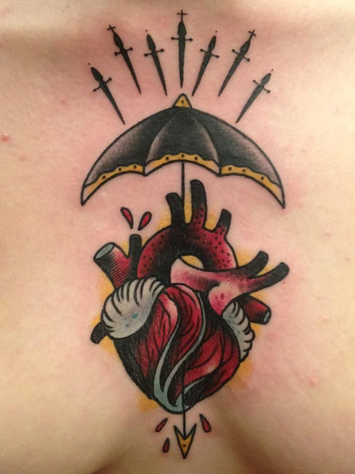 Human Heart With Umbrella Tattoo On Chest