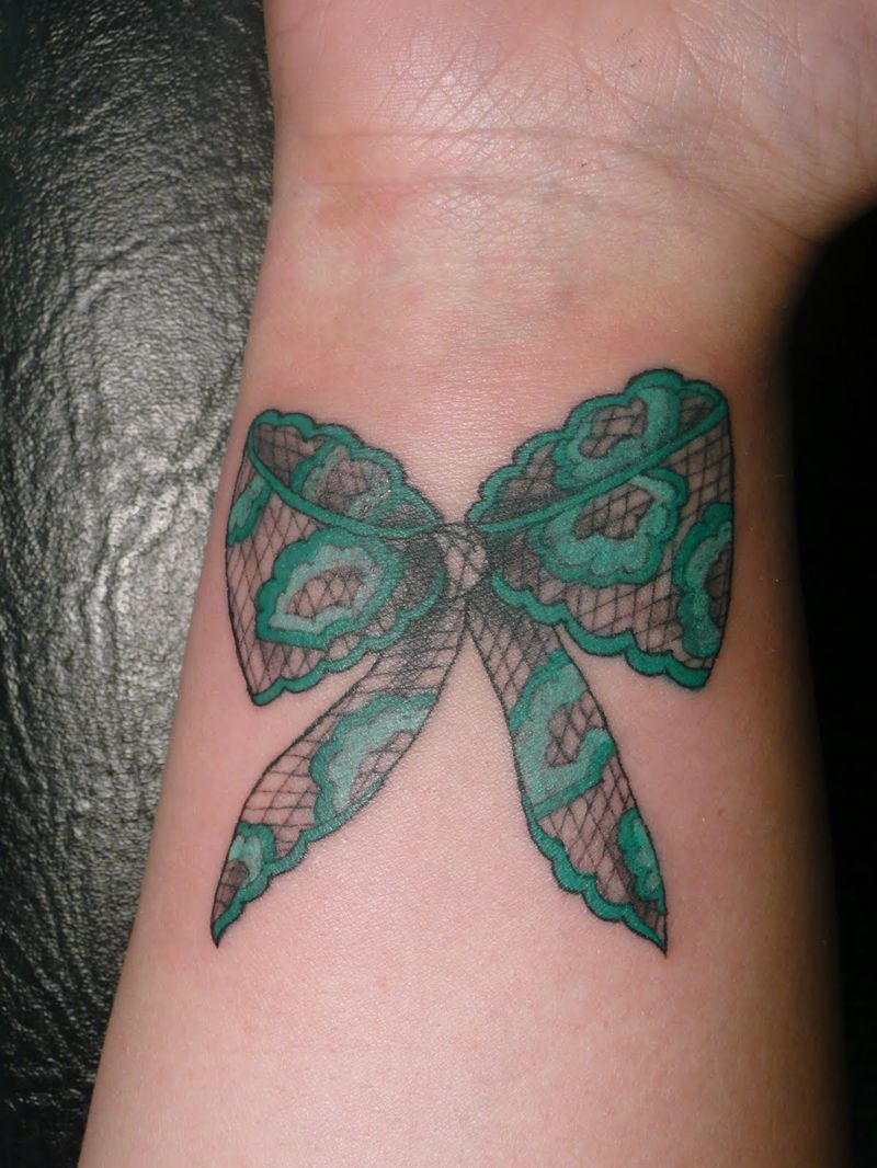 Lace Bow Tattoo On Right Wrist