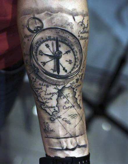 Man With Map And Compass Tattoo On Left Forearm