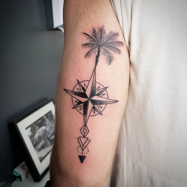 Nautical Compass And Palm Tree Tattoo On Bicep