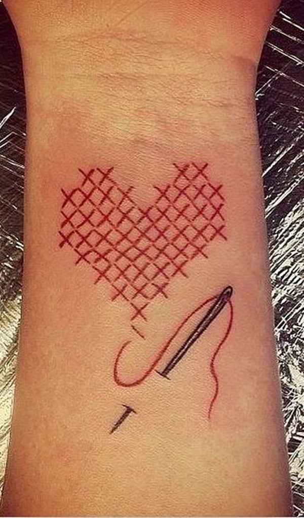 Needle And Thread Pierced Heart Tattoo On Wrist