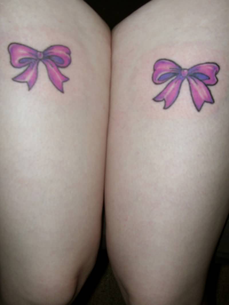 Nice Pink Small Bow Tattoos On Both Thighs