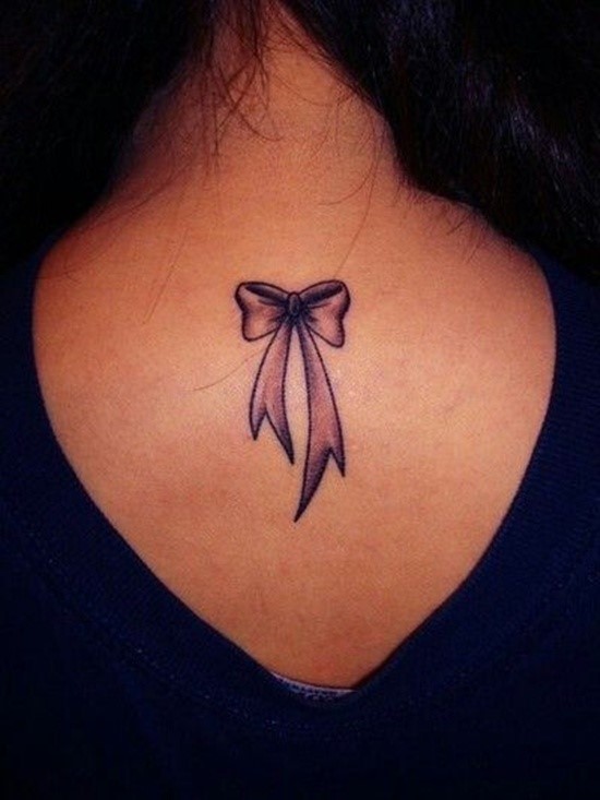 Nice Small Grey Bow Tattoo On Girl Upper Back
