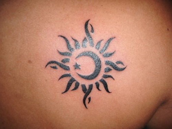 Nice Tribal Black Sun And Moon Tattoo On Back Shoulder