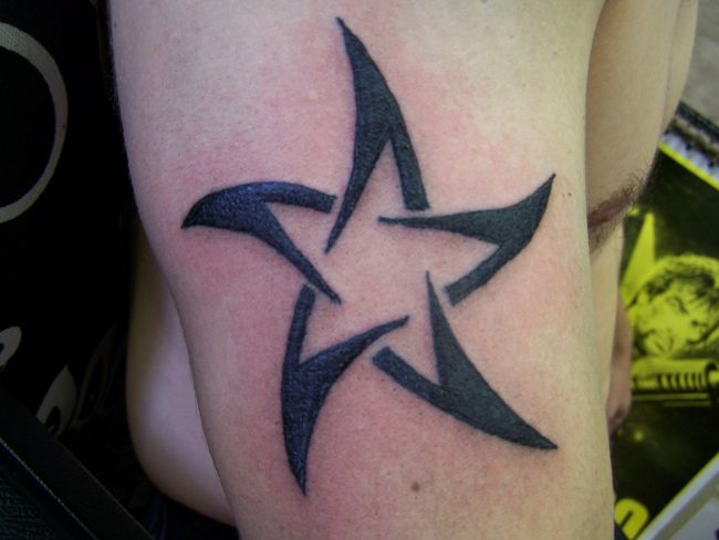 Outline Black Tribal Star Tattoo On Right Bicep