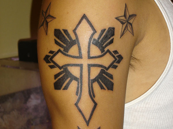 Outline Cross With Sun And Nautical Stars Tattoo On Right Shoulder
