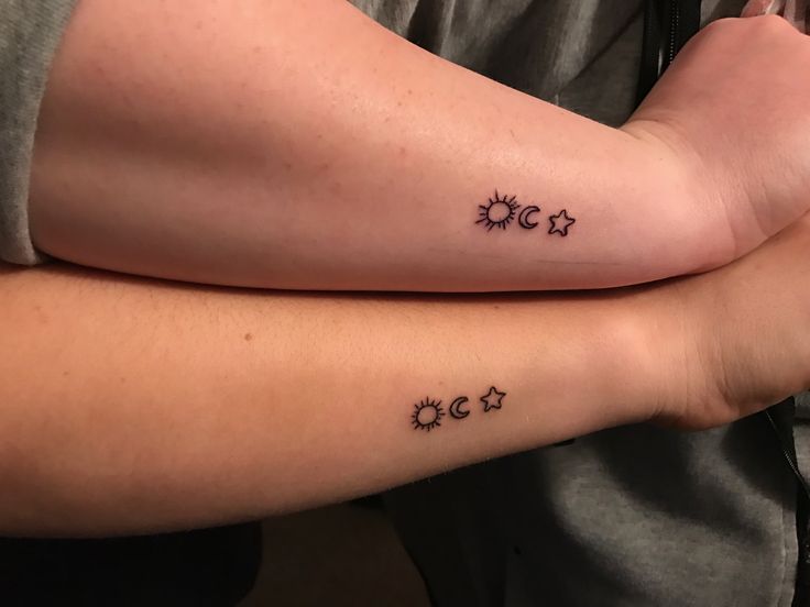 Outline Small Star And Sun Tattoos On Both Arm