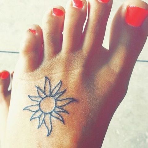 Outline Small Sun Tattoo On Girl Left Foot