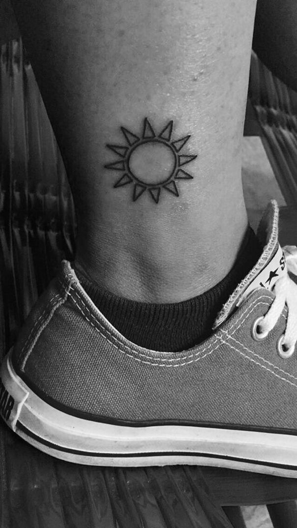 Outline Small Sun Tattoo On Side Leg