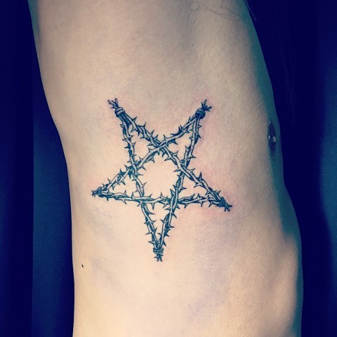 Pentagram Star With Barbed Wire Tattoo On Side Rib
