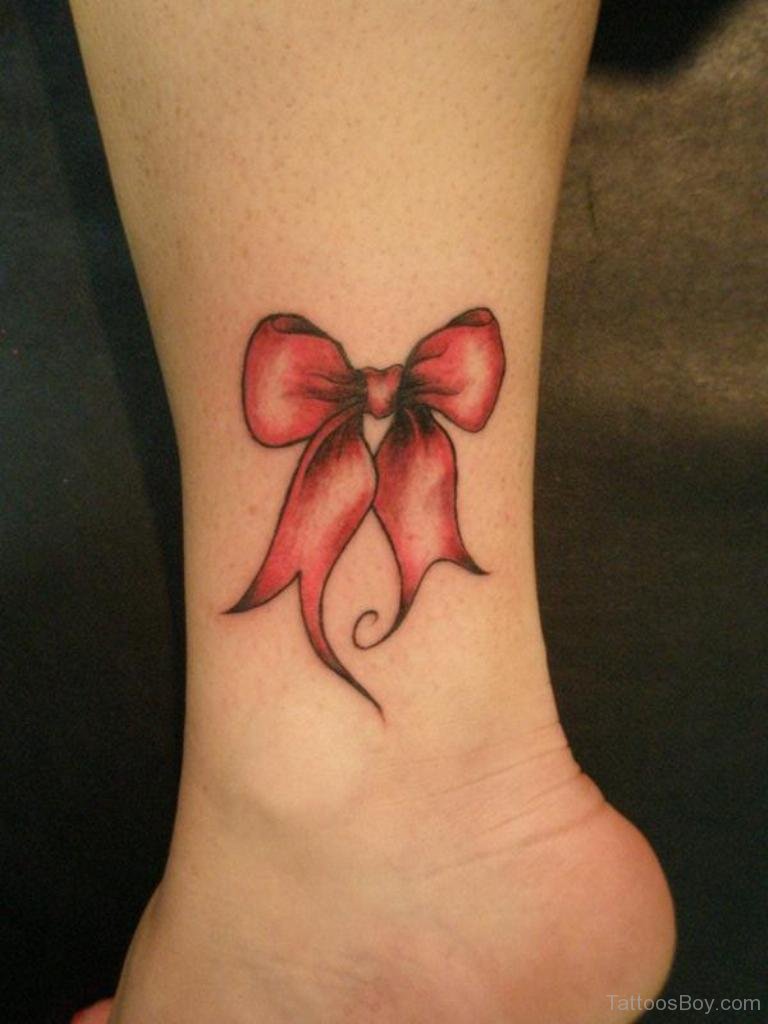 Pink Shaded Bow Tattoo On Side Leg