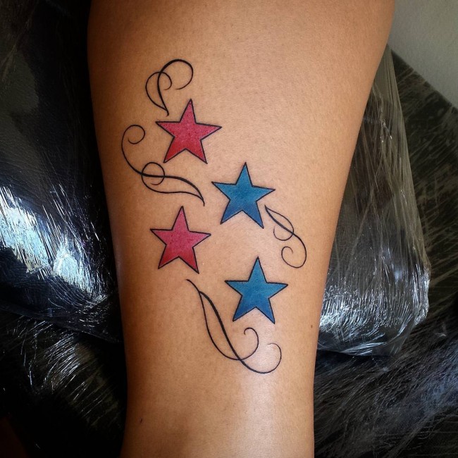 Red And Blue Star Tattoos On Side Leg