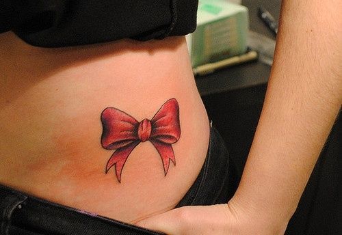 Red Bow Tattoo On Girl Left Hip