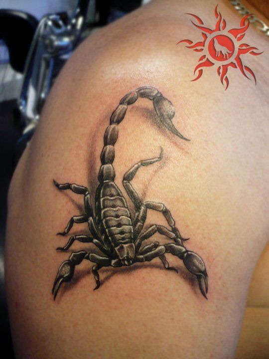 Red Tribal Sun And Scorpion Tattoo On Right Shoulder