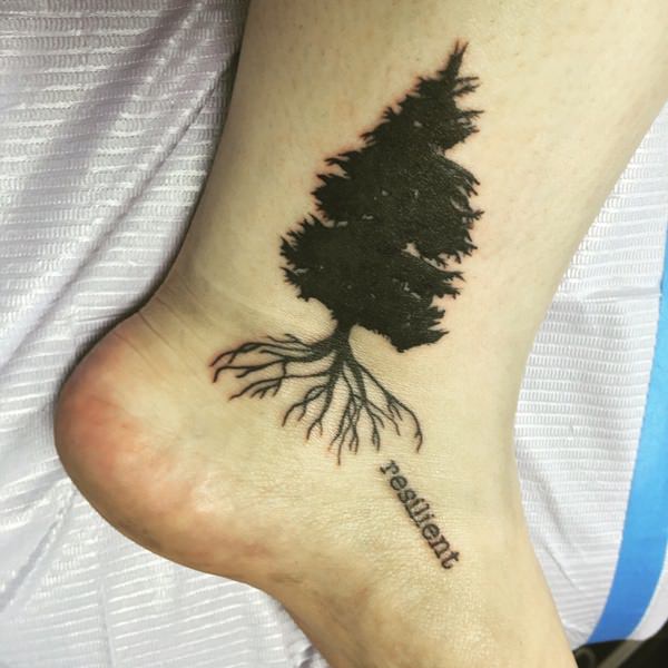 Resilient Black Tree Tattoo On Ankle
