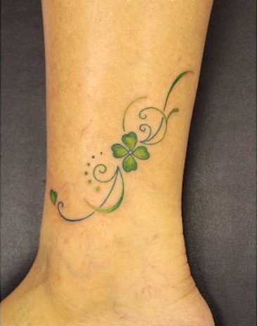 Shamrock Tattoo On Girl Left Leg