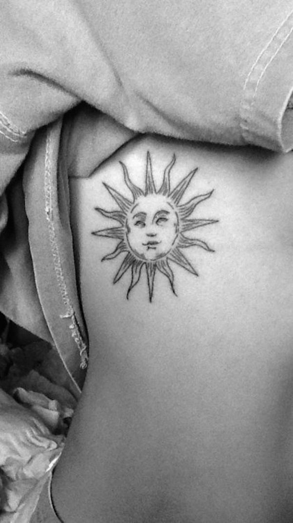 Side Rib Small Sun Tattoo Idea