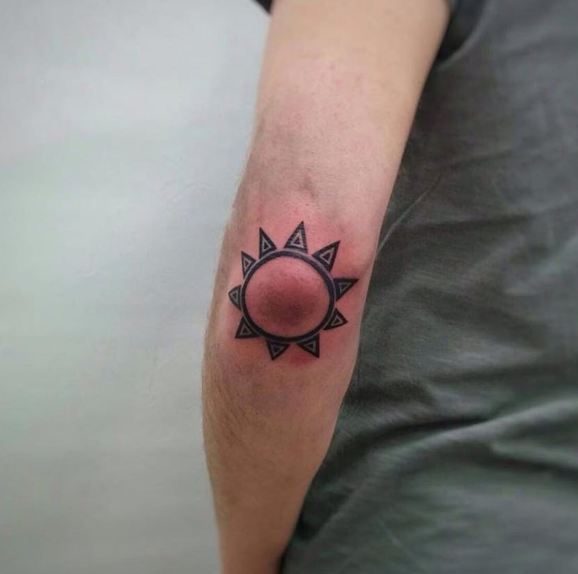 Simple Sun Tattoo On Elbow