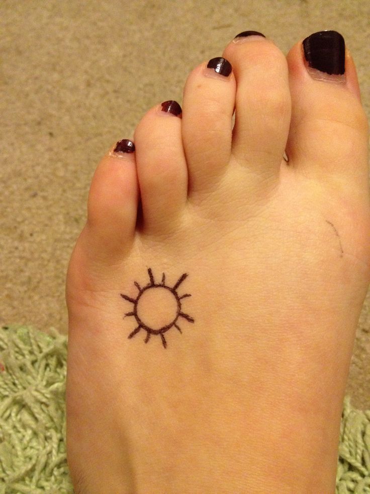 Simple Sun Tattoo On Girl Left Foot