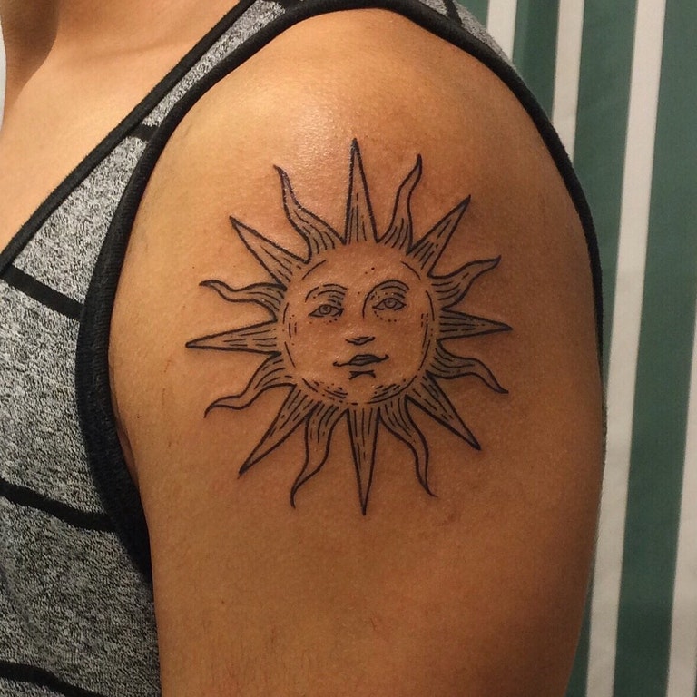 Simple Sun Tattoo On Left Shoulder