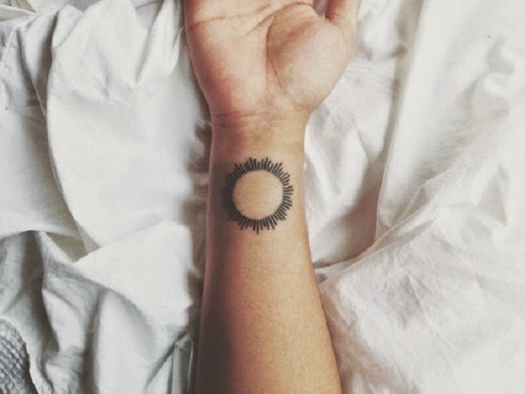 Simple Sun Tattoo On Right Wrist