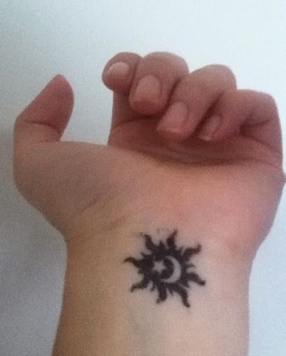 Small Moon And Sun Tattoo On Left Wrist