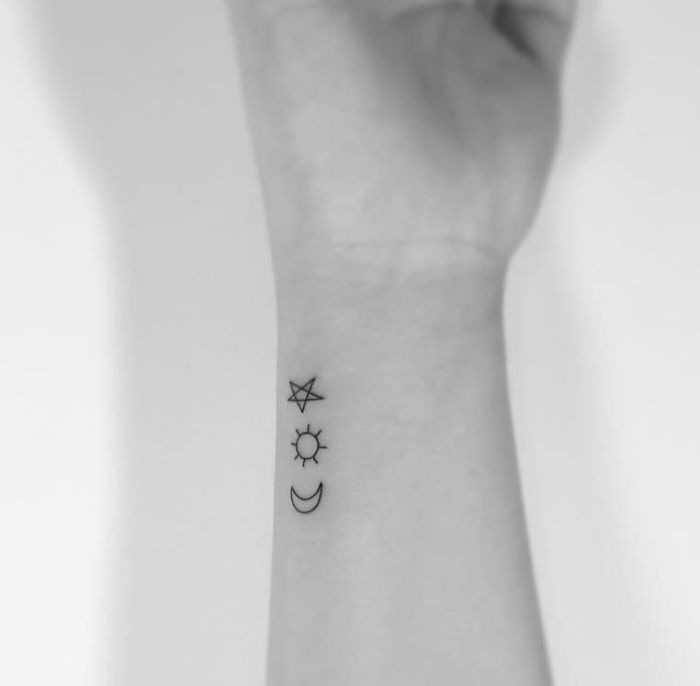 Small Star With Moon And Sun Tattoo On Forearm