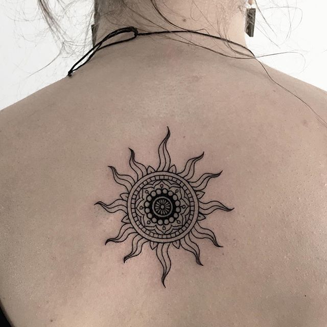 Small Sun Tattoo On Girl Upper Back