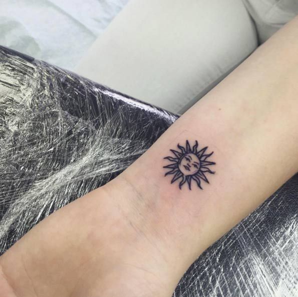 Small Sun Tattoo On Left Wrist