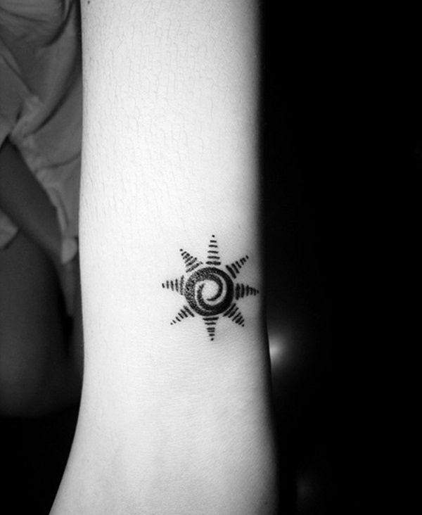 Small Tribal Sun Tattoo On Left Wrist