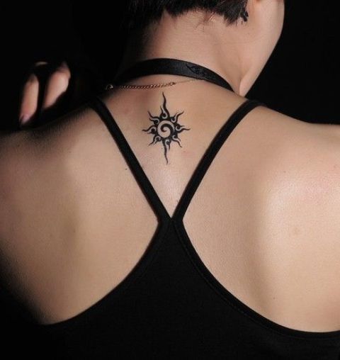 Small Tribal Sun Tattoo On Upper Back
