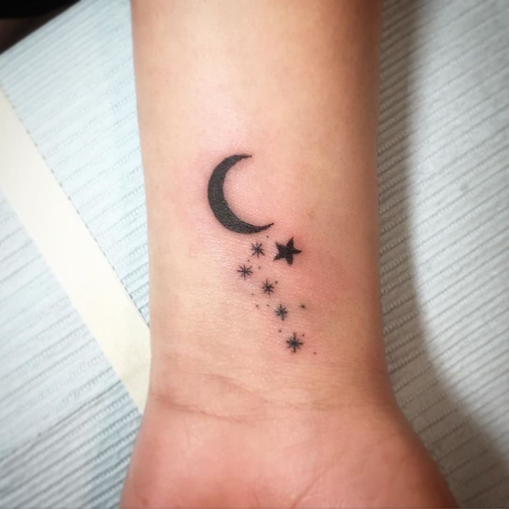 Stars And Black Moon Tattoo On Wrist