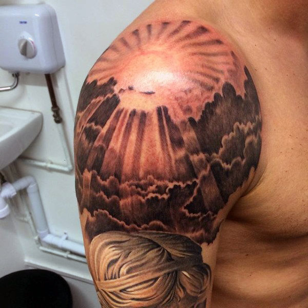 Sun And Sun Rays In Clouds Tattoo On Right shoulder