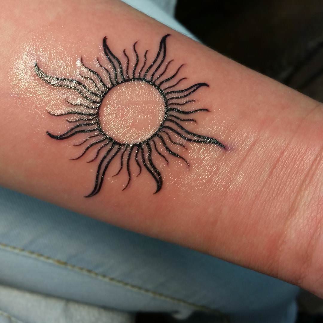 Sun Tattoo On Forearm