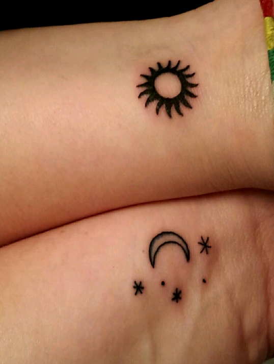 Three Stars With Moon And Sun Tattoos On Wrists