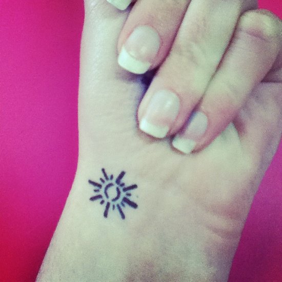 Tiny Sun Tattoo On Wrist For Girls