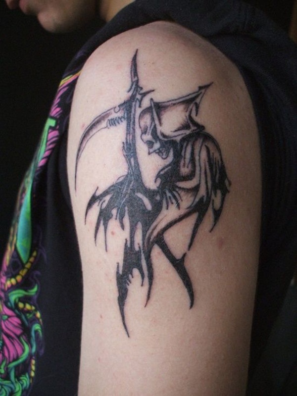 Tribal Grim Reaper Tattoo On Man Left Shoulder