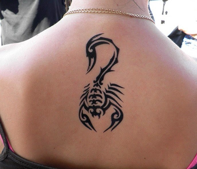 Tribal Scorpion Tattoo On Girl Upper Back