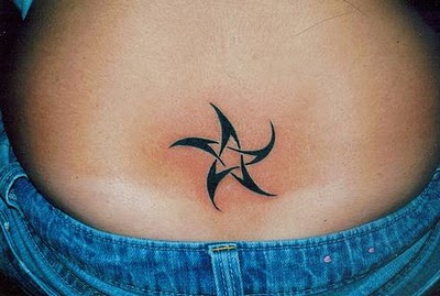 Tribal Star Tattoo On Lower Back