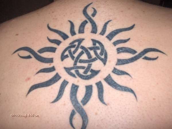 Tribal Sun And Celtic Tattoo On Upper Back
