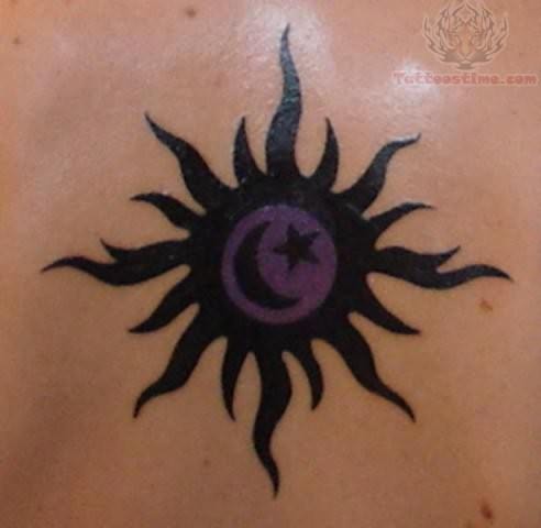 Tribal Sun And Star Tattoo On Upper Back