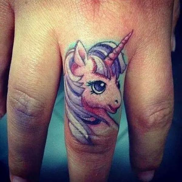 Unicorn Head Tattoo On Middle Finger