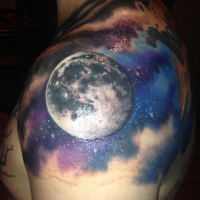 Watercolored Full Moon Tattoo On Man Left Shoulder